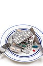 Overmedication -Capsules and hidden in a close-up plate with the broods.