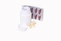 Drug capsule. Medicine is a capsule brown that is placed in a panel and white plastic bottle. Royalty Free Stock Photo