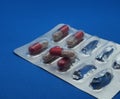 The drug in capsules. Capsules lie in plastic transparent packaging