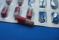 The drug in capsules. Capsules lie in plastic transparent packaging