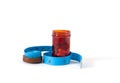 The drug or pills in red bottle with blue measuring tape on isolated Royalty Free Stock Photo