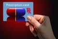 A drug prescription card is held in a girlÃ¢â¬â¢s hand Royalty Free Stock Photo