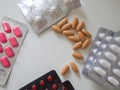 Assorted pharmaceutical medicine pills on white backround