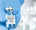 Drug vial with label Vaccines Save Lives