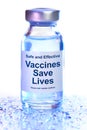 Drug vial with label - Vaccines Save Lives Royalty Free Stock Photo