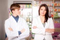 Druggist and client in front of pharmacy table
