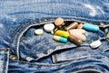 Drugs on denim background. Mixing medicines. Fast treatment. Medicine prescription. Health care and illness. Dose and