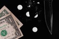Drugs and money scattered on a black background Royalty Free Stock Photo