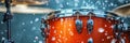 A drum is being played in the rain, with water droplets falling off of it Royalty Free Stock Photo