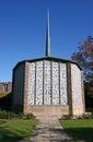Chapel with stone base, brick columns, white perforated screens and spire at St Paul`s College, University of Sydney, Australia