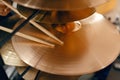 Drum cymbals and drumsticks in music store