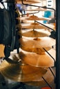 Drum cymbals on showcase in music store, nobody