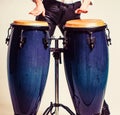 Drum. Hands of a musician playing on bongs. Performers playing bongo drums