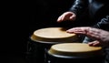 Drum. Hands of a musician playing on bongs. The musician plays the bongo. Close up of musician hand playing bongos drums Royalty Free Stock Photo