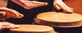 Drum. Hands of a musician playing on bongs. The musician plays the bongo. Close up of musician hand playing bongos drums