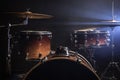 Drum kit on a dark background with stage lighting, copy space Royalty Free Stock Photo