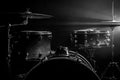 Drum kit on a dark background with stage lighting, copy space Royalty Free Stock Photo