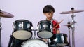 Drum kit or drum set with boy playing background Royalty Free Stock Photo