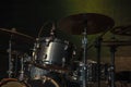 Drum kit kit is on a lit stage ready for use before a musical co Royalty Free Stock Photo