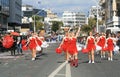 Drum majorettes marching along a street