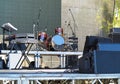 Drum set, microphones and speakers on stage