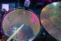 Drum set with a wooden drumstick and music notes