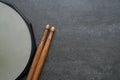 Drum stick and drum pad on black table background