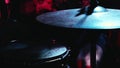 Drum stick playing hihat. Close up of drum plate hi hat and a drummer playing on drums. Musician playing metal cymbals close-up.