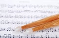 Drum sticks on sheet music