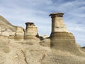 Drumheller HooDoos is a 0.5 kilometer heavily trafficked loop trail located near Drumheller, Alberta, Canada that features a cave Royalty Free Stock Photo