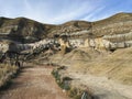 Drumheller HooDoos is a 0.5 kilometer heavily trafficked loop trail located near Drumheller, Alberta, Canada that features a cave Royalty Free Stock Photo