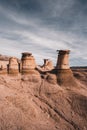 Drumheller HooDoos is a 0.5 kilometer heavily trafficked loop trail located near Drumheller, Alberta, Canada that features a cave Royalty Free Stock Photo