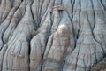 Drumheller HooDoos is a 0.5 kilometer heavily trafficked loop trail located near Drumheller, Alberta, Canada that features a cave Royalty Free Stock Photo