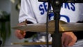 The drummer in action. Cose up process play on a musical instrument. Clip. A plate of the drum set. Close-up. Hand of