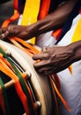 Drummer at a Caribbean Carnival, rhythmically beating a steel drum adorned with bright ribbons Royalty Free Stock Photo