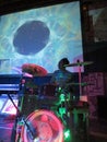 Drummer Jerome James jams on drums with trippy video show overhead