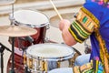 Drummer man playing drums percussion with sticks, drum kit on concert stage, drumsticks and drums Royalty Free Stock Photo