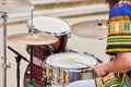 Drummer man playing drums percussion with sticks, drum kit on concert stage, drumsticks and drums Royalty Free Stock Photo