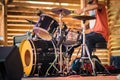 Drummer performing on stage at live concert.