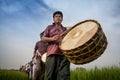 A Drummer Playing Drum in Gajan Festival.