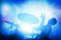 Drummer playing on drums on music concert. Club lights Royalty Free Stock Photo