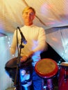 Drummer playing drums on stage