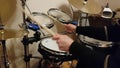 Drummer practicing percussion instruments at home d