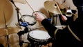 Drummer practicing percussion instruments at home during quarantine