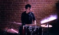 Drummer rehearsing on drums before rock concert.