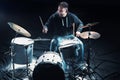 Drummer rehearsing on drums before rock concert. Man recording music on drum set in studio Royalty Free Stock Photo