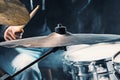 Drummer rehearsing on drums before rock concert. Man recording music on drum set in studio Royalty Free Stock Photo