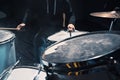 Drummer rehearsing on drums before rock concert. Man recording music on drum set in studio Royalty Free Stock Photo