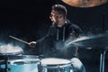 Drummer rehearsing on drums before rock concert. Man recording music on drum set in studio Royalty Free Stock Photo