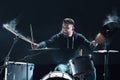 Drummer rehearsing on drums before rock concert. Man recording music on drum set in studio Royalty Free Stock Photo